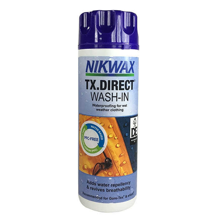 Nikwax TX-Direct Wash-In Flasche mit blauem Deckel und Aufschrift, Produkt für Imprägnierung