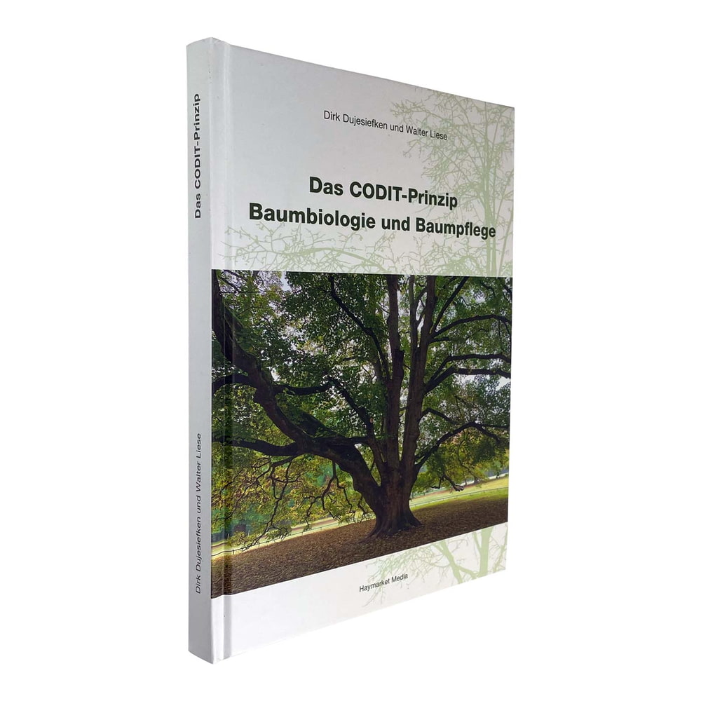 Buch "Das CODIT Prinzip – Baumbiologie und Baumpflege" von Dirk Dujesiefken und Walter Liese, schräg von vorne mit Baum auf dem Cover