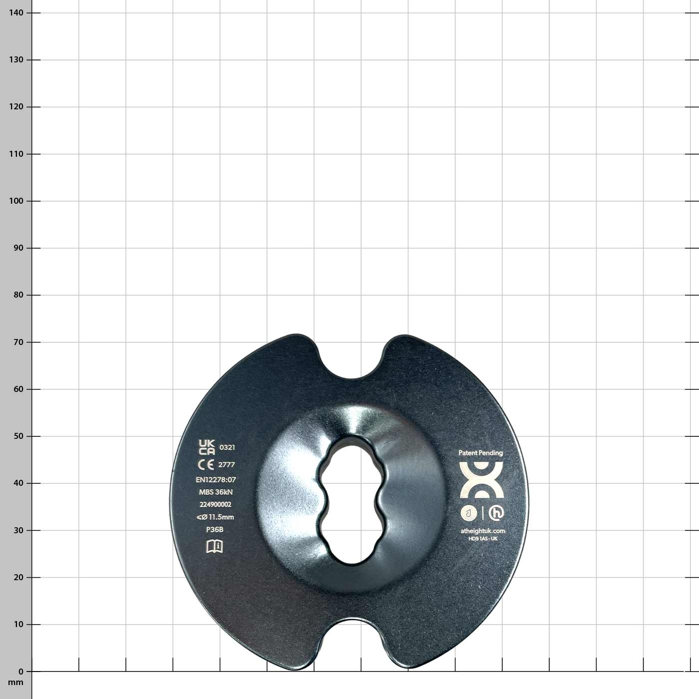 PulleyOne Pro schwarze Scheibe mit Aufdruck und mittiger Aussparung vor weißem Hintergrund mit Raster