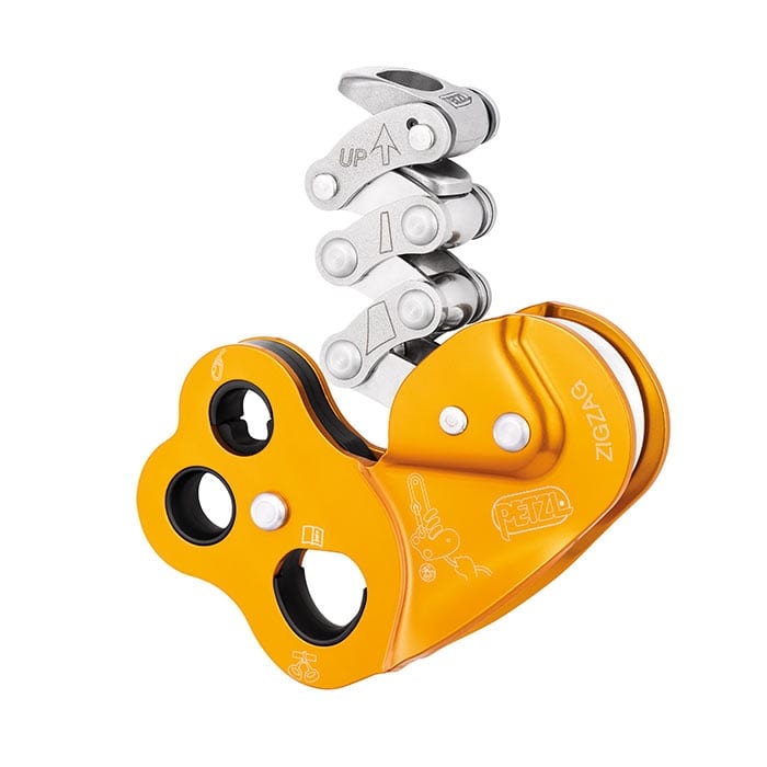 Petzl ZigZag gelbes Seilzugsystem mit silbernen Metallhebeln und mehreren Löchern im Gehäuse