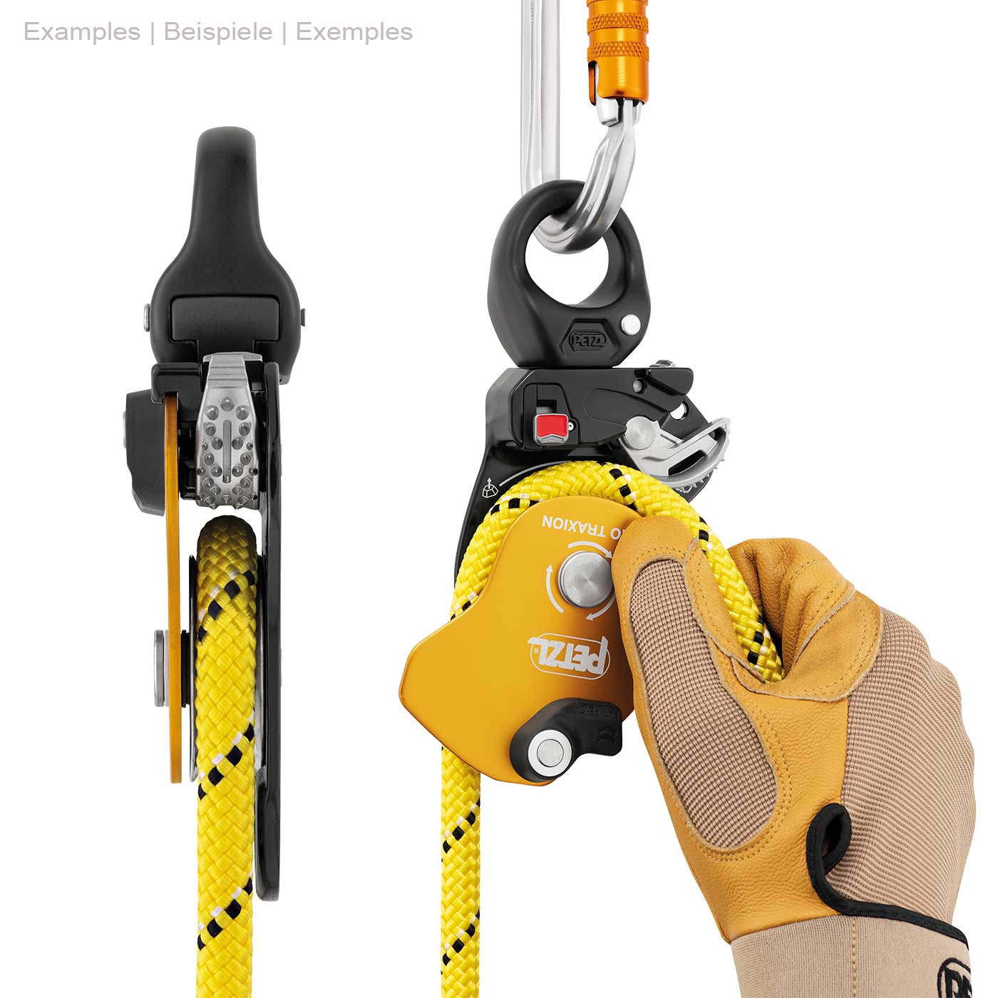 Petzl Pro Traxion Seilrolle in Gelb und Schwarz mit gelbem Seil, gehalten von einer Hand mit Arbeitshandschuh, oben mit einem silbernen Karabinerhaken befestigt