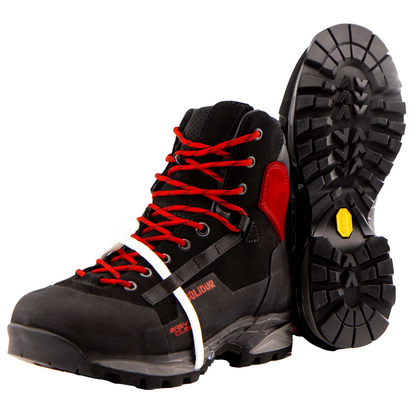 TreeClimb schwarzer Bergschuh mit roten Schnürsenkeln und rotem Fersenpolster, eine Schuhsohle ist sichtbar mit Profil und gelbem Logo