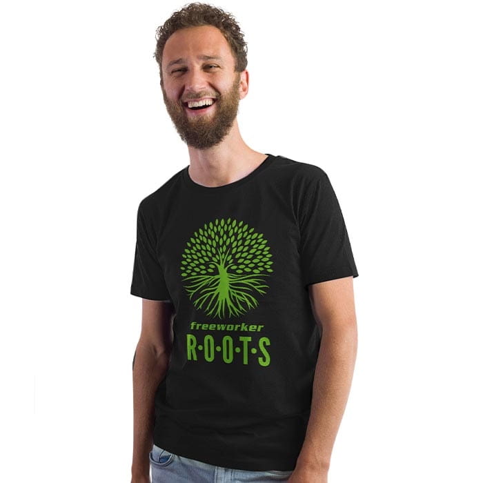 Mann mit Bart trägt schwarzes T-Shirt mit grünem Baum- und Wurzeldesign und Schriftzug "freeworker ROOTS" auf der Vorderseite, Produktname Roots Pure Men