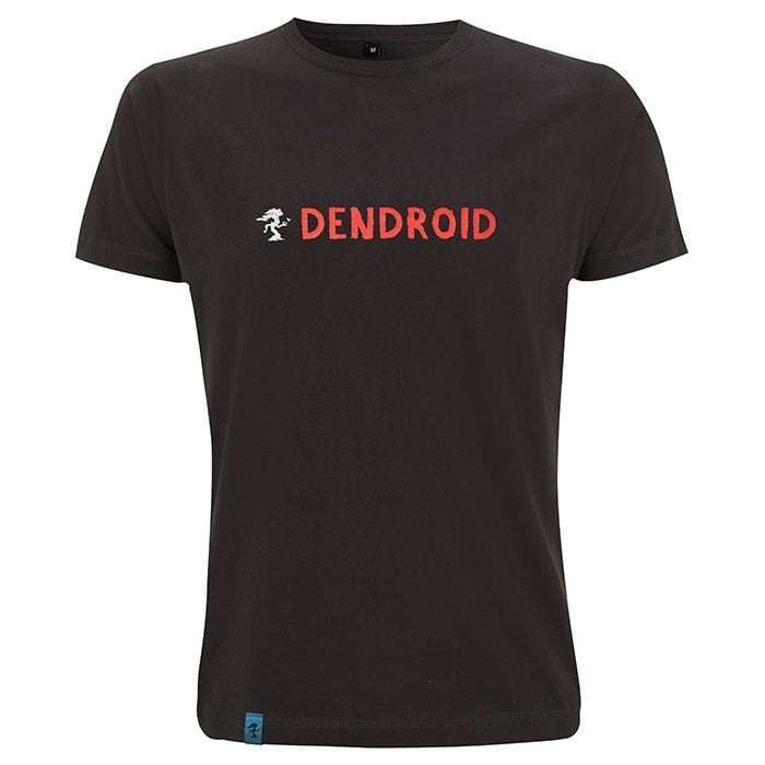 Dream Day T-Shirt von DENDROID in Schwarz mit großem, rundem Motiv auf der Rückseite, das eine Landschaft mit Bäumen, Bergen, einem Mond, einem Helikopter und einer Person mit Helm zeigt