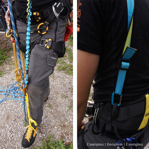 Bungeetool in Blau mit elastischem, gewelltem Abschnitt und flachem Gurtband mit schwarzem Rand und grünem Innenstreifen an grauer Outdoorhose mit Kletterausrüstung und gelb-schwarzen Bergschuhen