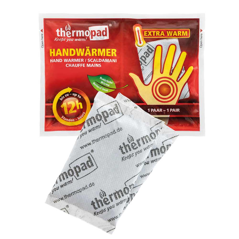 Handwärmer von thermopad in roter Verpackung mit gelber Handgrafik und einem weißen Wärmekissen mit thermopad-Aufdruck davor
