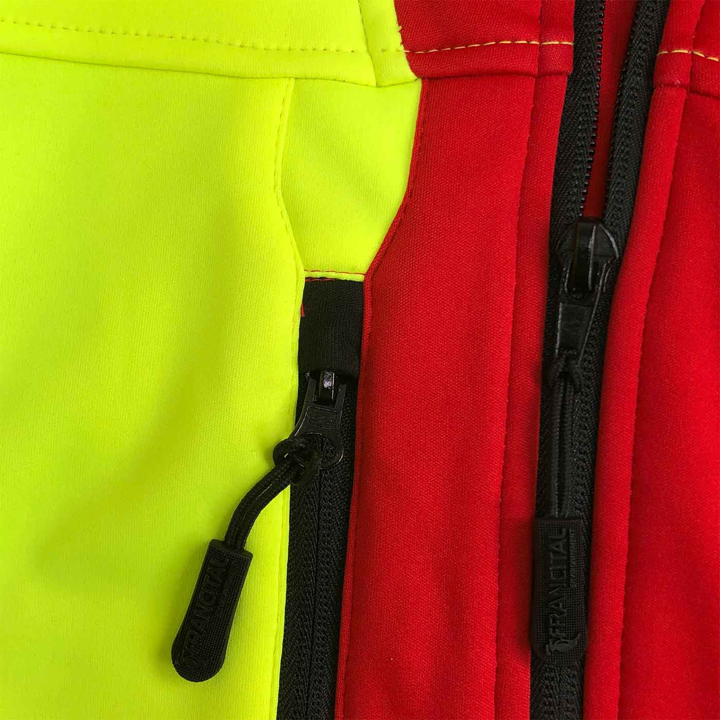 Aigoual R Jacke Nahaufnahme der schwarzen Reißverschlüsse und des roten und gelben Stoffes