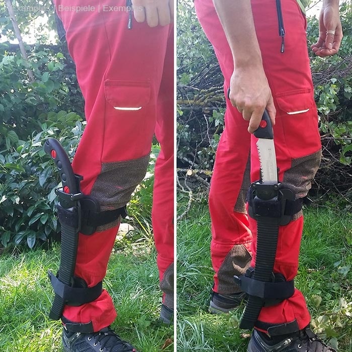 Person trägt rote Hose und schwarzes Schuhwerk, an rechtem Bein ist der Talon Mount mit schwarzer Handsäge befestigt